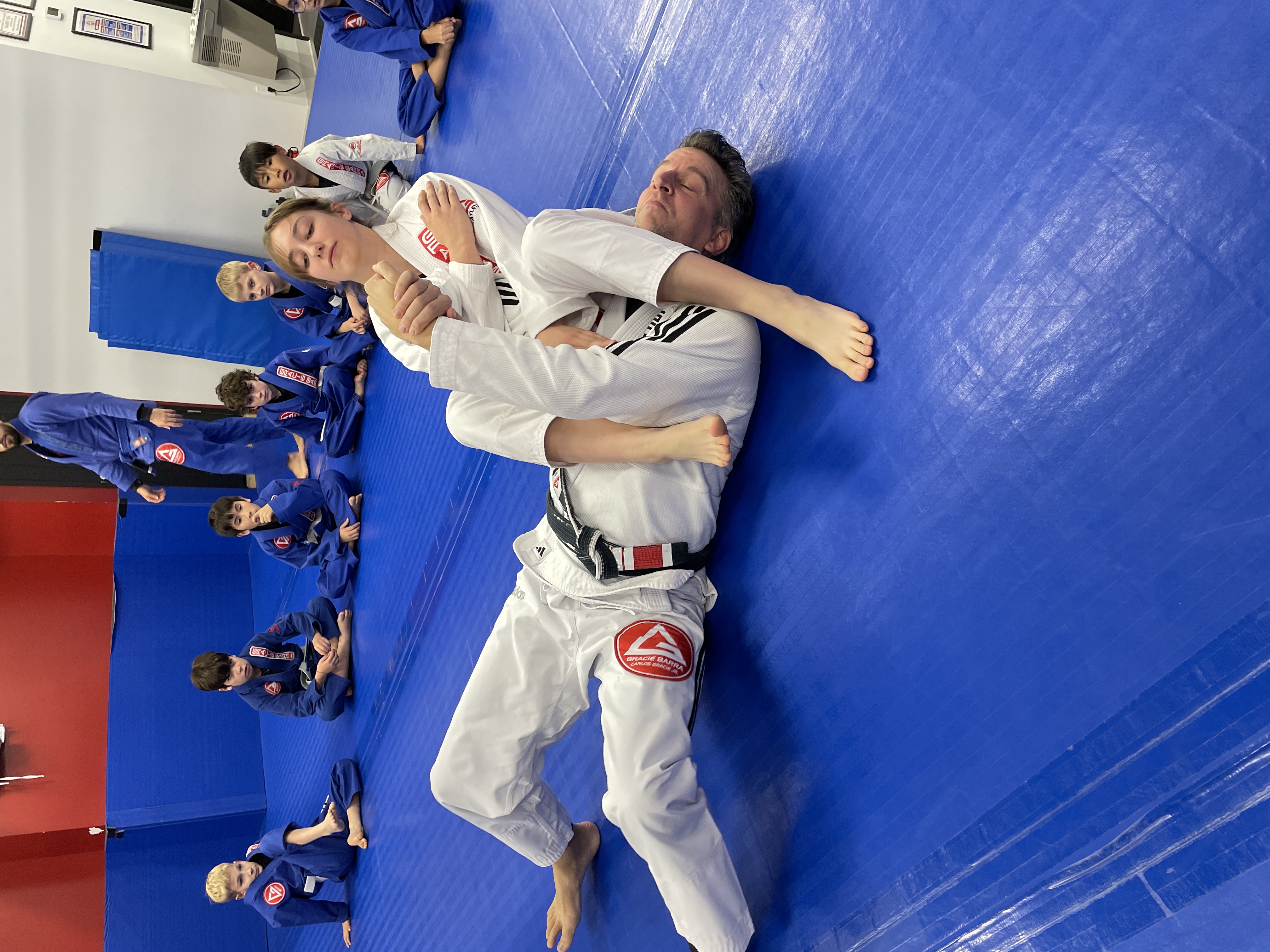 Instructor demonstrating technique kids BJJ Montreal