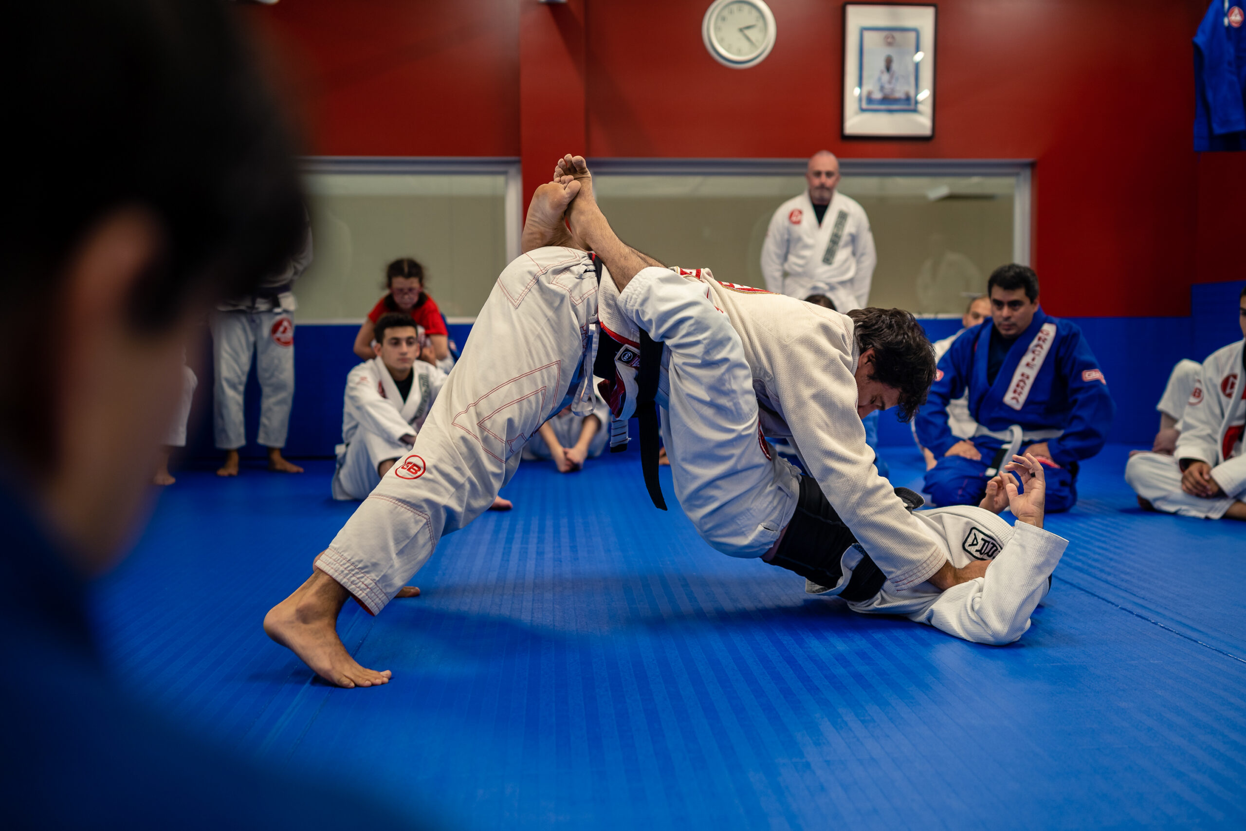 Gracie Barra Saint-Laurent instructor with adult students Montreal